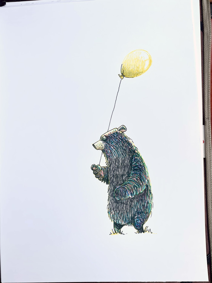 Bear with a yellow balloon